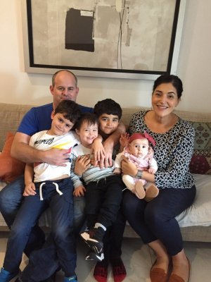 The Holohan family. Credit: Vicki Holohan. The Holohan family sitting on a couch, with four children on their parents' laps